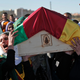 Illustration for article titled Syrian Mourners Carry Coffin of Female Kurdish Fighter Killed at 20